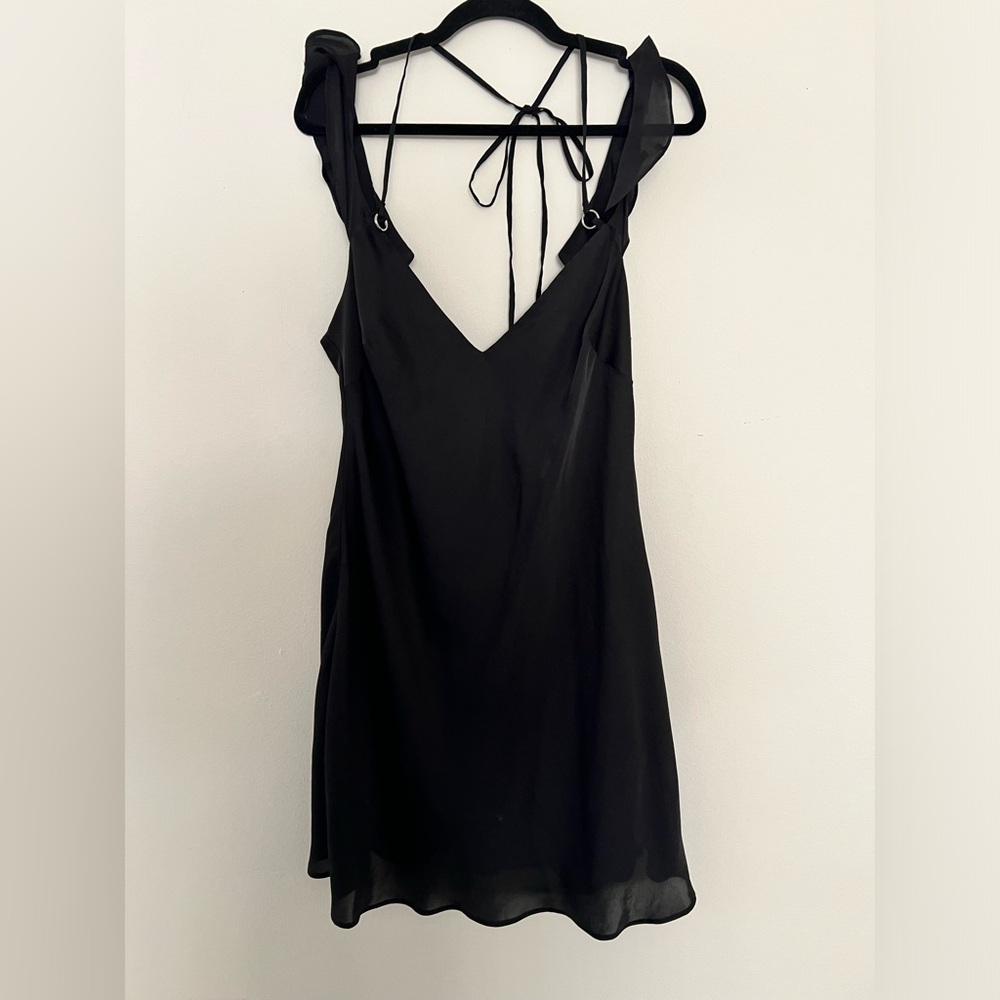 Free People silky slip dress with metal detail and ties in the back. Size L.